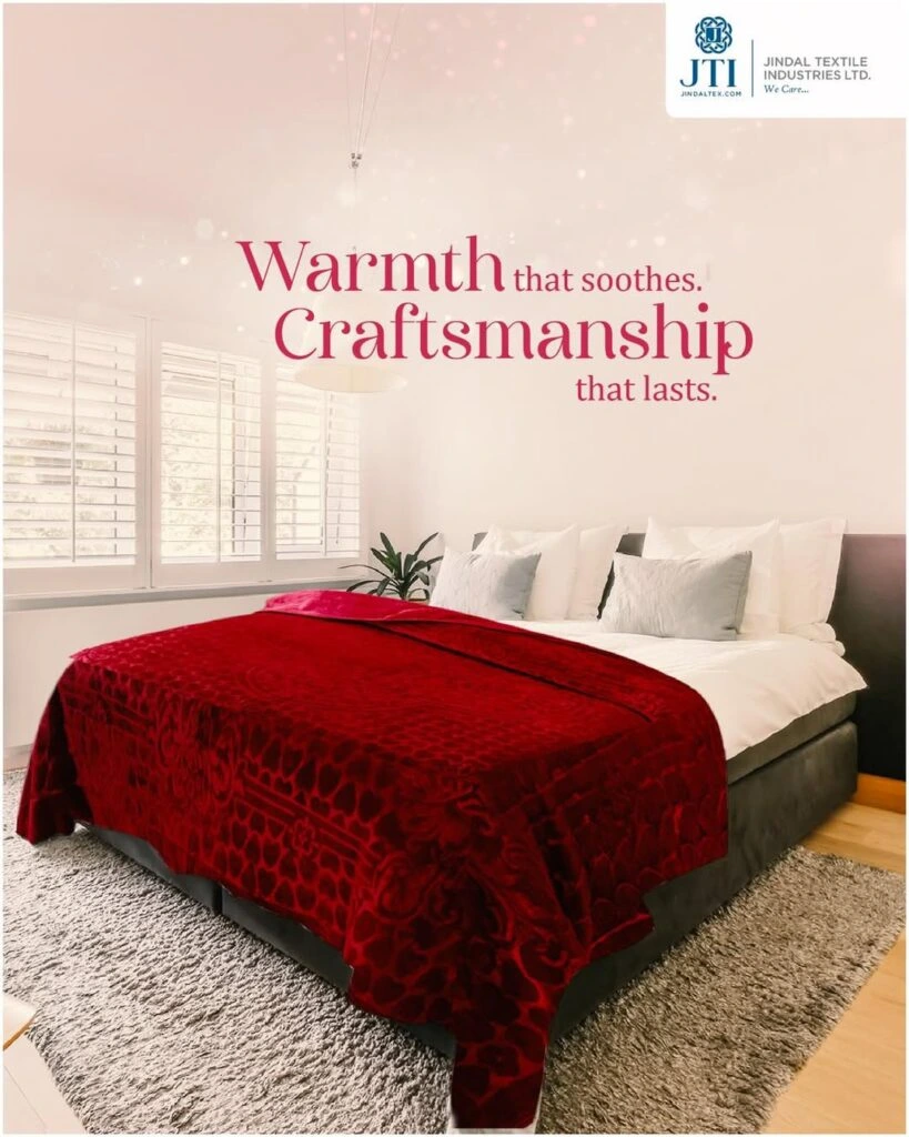 Elegant bedroom featuring a deep red textured blanket and soft white pillows
