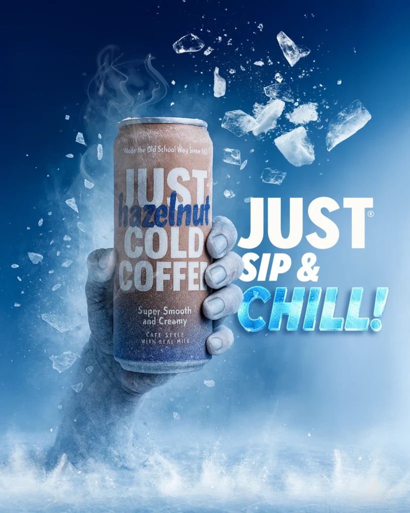 JUST Hazelnut Cold Coffee frozen can held by an ice hand