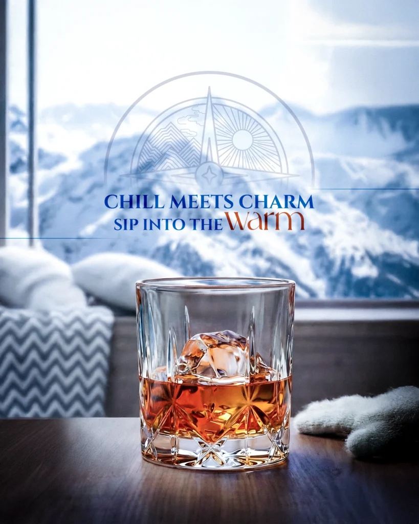 Soorahi whisky glass with ice overlooking a snowy mountain view